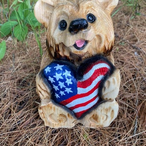 Chainsaw carved bear patriotic wood carving American flag log home decor rustic Americana carved bear red white and blue flag heart figurine