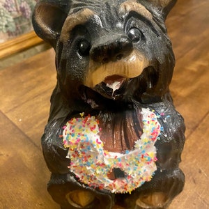 Black bear with donut chainsaw carving woodcarved bear sculpture rustic handcrafted art gift for mom unique Christmas present for parents