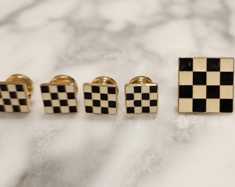 Juego de gemelos con diseño de tablero de ajedrez amarillo y negro y 4 botones a juego