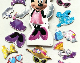 24 Magnetic Minnie Mouse pieces Dress up outfits and accessories with stand. A Melissa and Doug brand