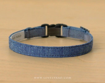 May include: A blue denim dog collar with a black plastic buckle. The collar is made of a soft, durable material and is adjustable for a comfortable fit.