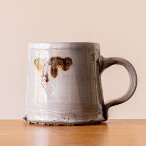 Small White Handmade Pottery Mug with Pale Blue Brushed Decoration #1