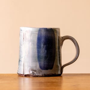 Small White Handmade Pottery Mug with Blue Leaf and Brushed Decoration
