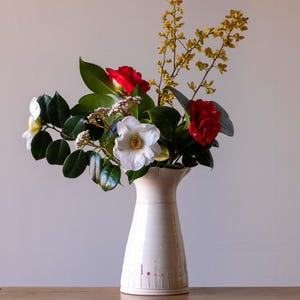 Large white handmade pottery vase with flared rim and Midsummer flower design
