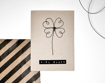 Folding card “Good luck” with a wire cloverleaf including an envelope