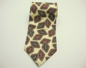 May include: A cream-colored necktie with a repeating pattern of diamond shapes. Each diamond is outlined in a dark color and filled with a floral design in red, navy, and cream. The tie is made of a smooth fabric.