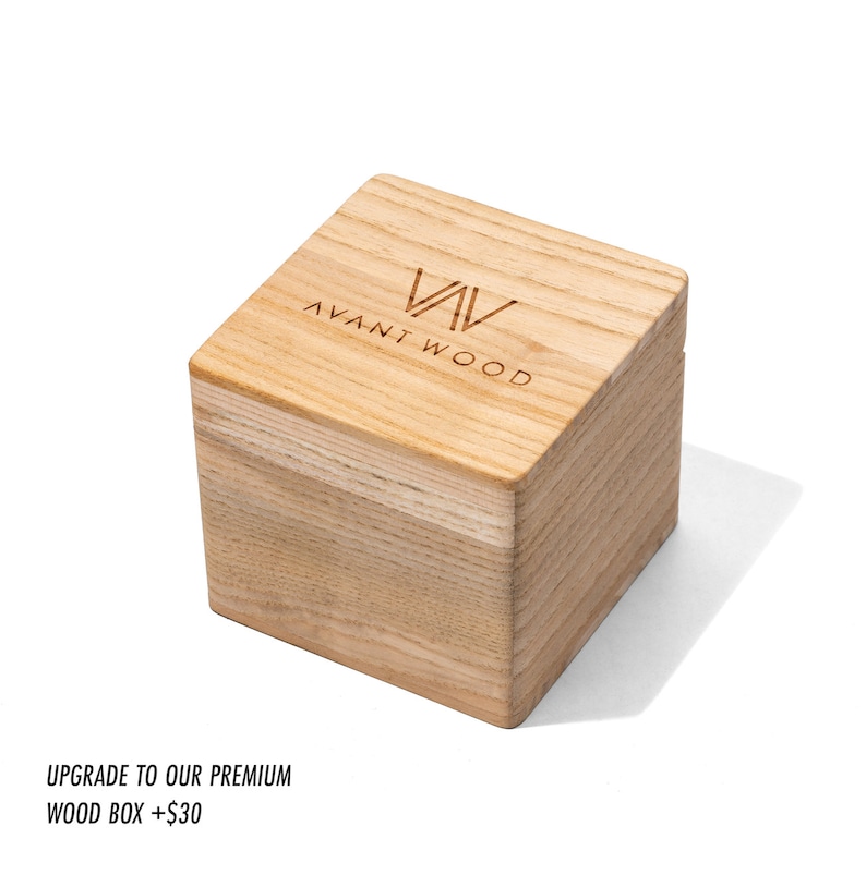 May include: A wooden box with the text "AVANT WOOD" engraved on the top. The box is made of light wood and has a natural finish.