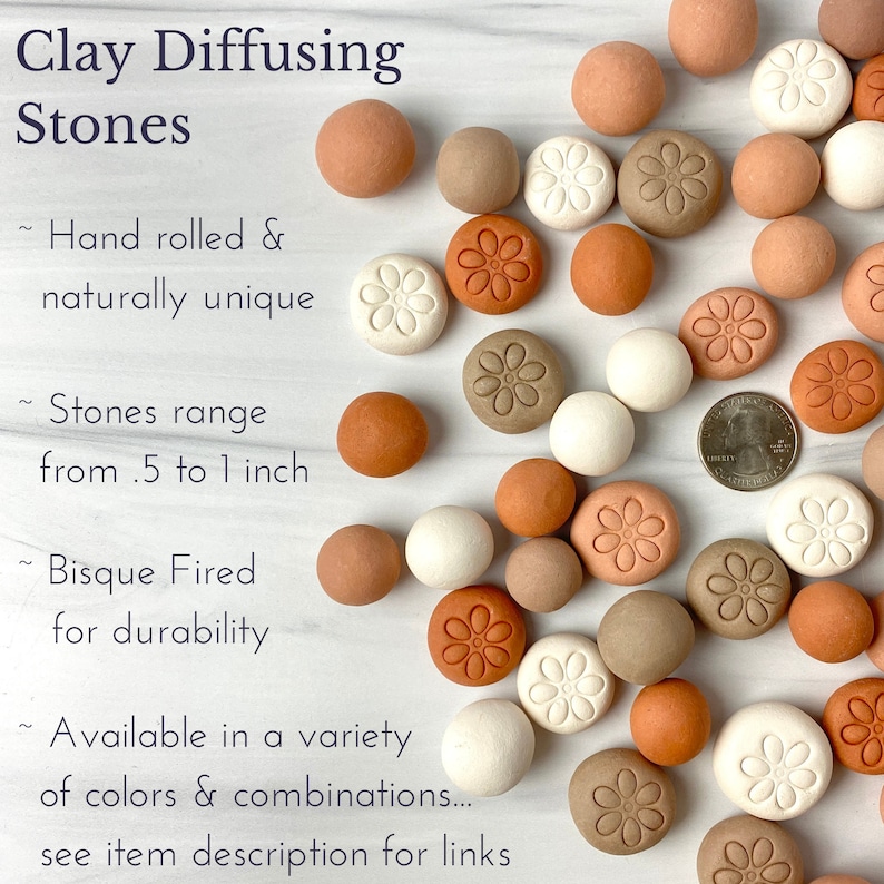 May include: A collection of hand-rolled clay diffusing stones in various shades of brown, beige, and white. The stones are decorated with a simple flower design and range in size from 0.5 to 1 inch.  "Clay Diffusing Stones", "Hand rolled & naturally unique", "Stones range from .5 to 1 inch", "Bisque Fired for durability", "Available in a variety of colors & combinations... see item description for links" are written on the image.