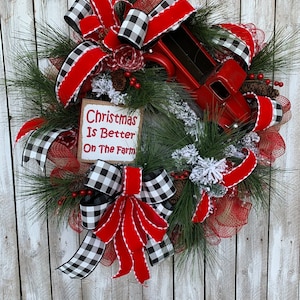 May include: A Christmas wreath with a red truck, red and black buffalo check ribbon, and a burlap sign that reads "Christmas Is Better On The Farm".