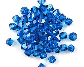 24 4mm Swarovski crystal xilion bicone 5328 Capri blue 17510
