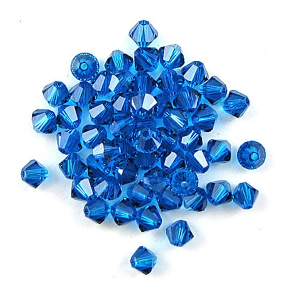 24 4mm Swarovski crystal xilion bicone 5328 Capri blue 17510