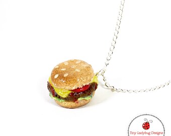 Polymer clay cheeseburger charm, earrings, ring, cell phone dust plug or keychain.