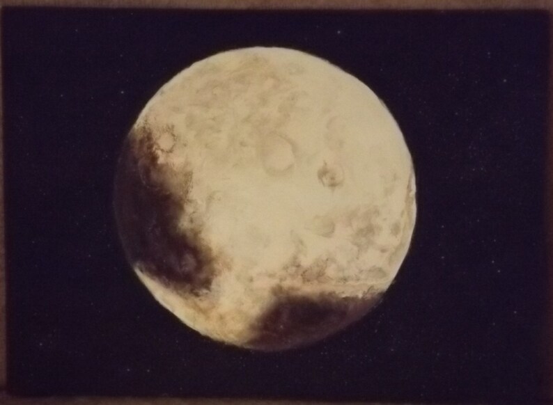 May include: A close-up image of Pluto, a dwarf planet in our solar system. The surface of Pluto is a light beige colour with dark brown patches and craters. The background is a dark blue with scattered white stars.