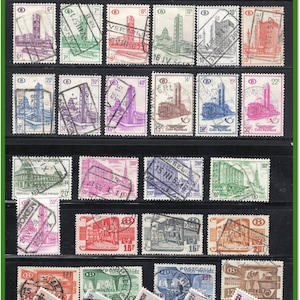 May include: A collection of vintage Belgian postage stamps, showcasing architectural designs and transport themes. The stamps are in various colours, including blue, red, and green, and are postmarked with dates and locations.