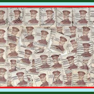May include: A collection of vintage postage stamps featuring a portrait of a man in uniform. The stamps are in various shades of brown, green, and blue, and some have red and white accents. The stamps are arranged in a grid pattern, and some are overlapping.