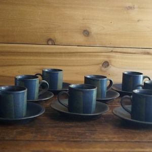May include: Set of eight blue and green striped ceramic coffee cups and saucers.