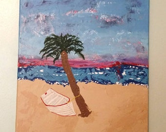 Palmera en la playa con barco