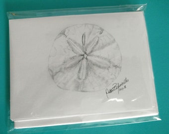 Tarjetas de nota en dólares de arena