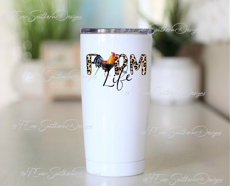May include: A white stainless steel tumbler with a black lid. The tumbler features the words "Farm Life" in a mix of leopard print and black script, with a colorful rooster graphic.