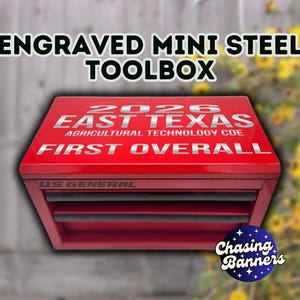 May include: A red engraved mini steel toolbox with the text "ENGRAVED MINI STEEL TOOLBOX" at the top. The toolbox has the text "2026 EAST TEXAS AGRICULTURAL TECHNOLOGY CDE FIRST OVERALL" in silver. The brand "US GENERAL" is visible.