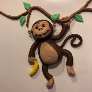 Monkey hanging from vine cake topper