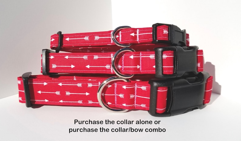 May include: Three red dog collars with white arrow patterns stacked on top of each other. The collars have black plastic buckles and silver metal D-rings. The text "Purchase the collar alone or purchase the collar/bow combo" is at the bottom of the image.