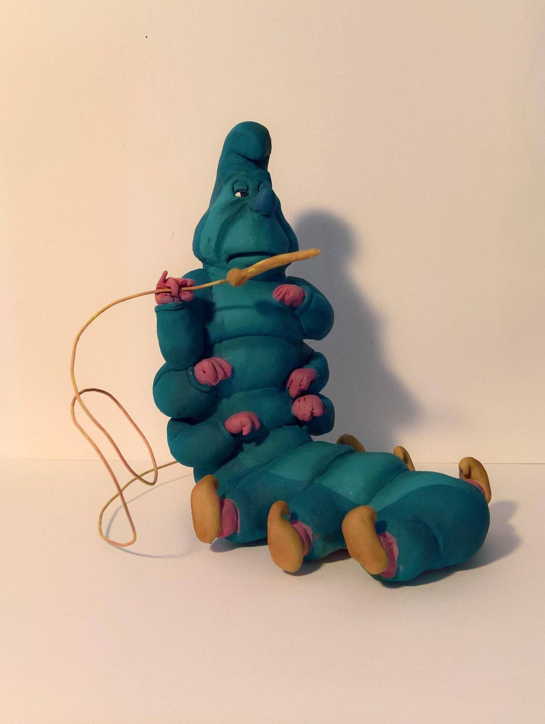 alice in wonderland caterpillar garden statue
