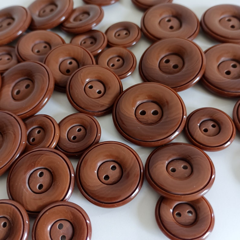 the photo shows brown plastic buttons