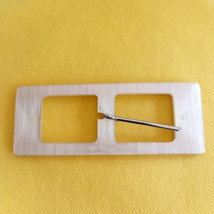 the photo shows white plastic buckle