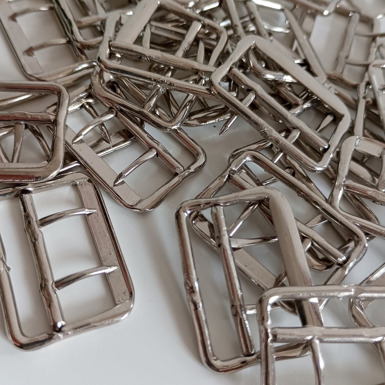 the photo shows vest silver metal buckles fasteners