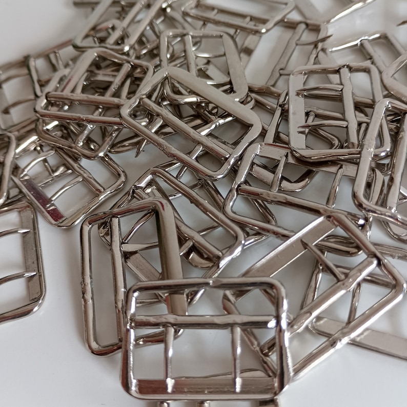 the photo shows vest silver metal buckles fasteners