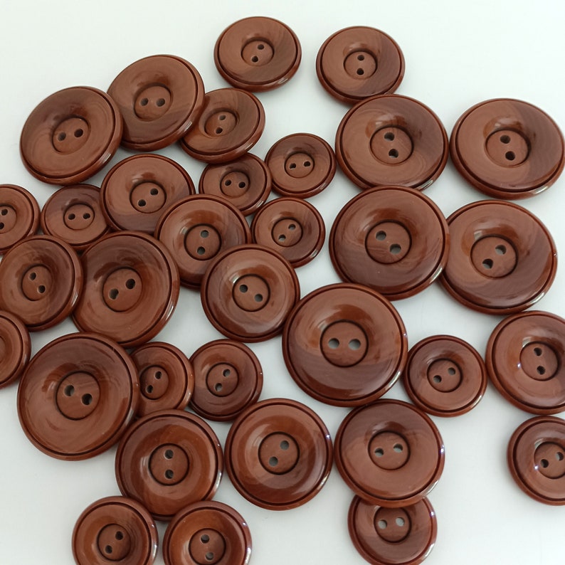 the photo shows brown plastic buttons