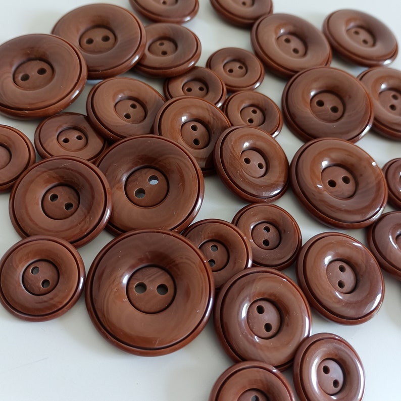 the photo shows brown plastic buttons