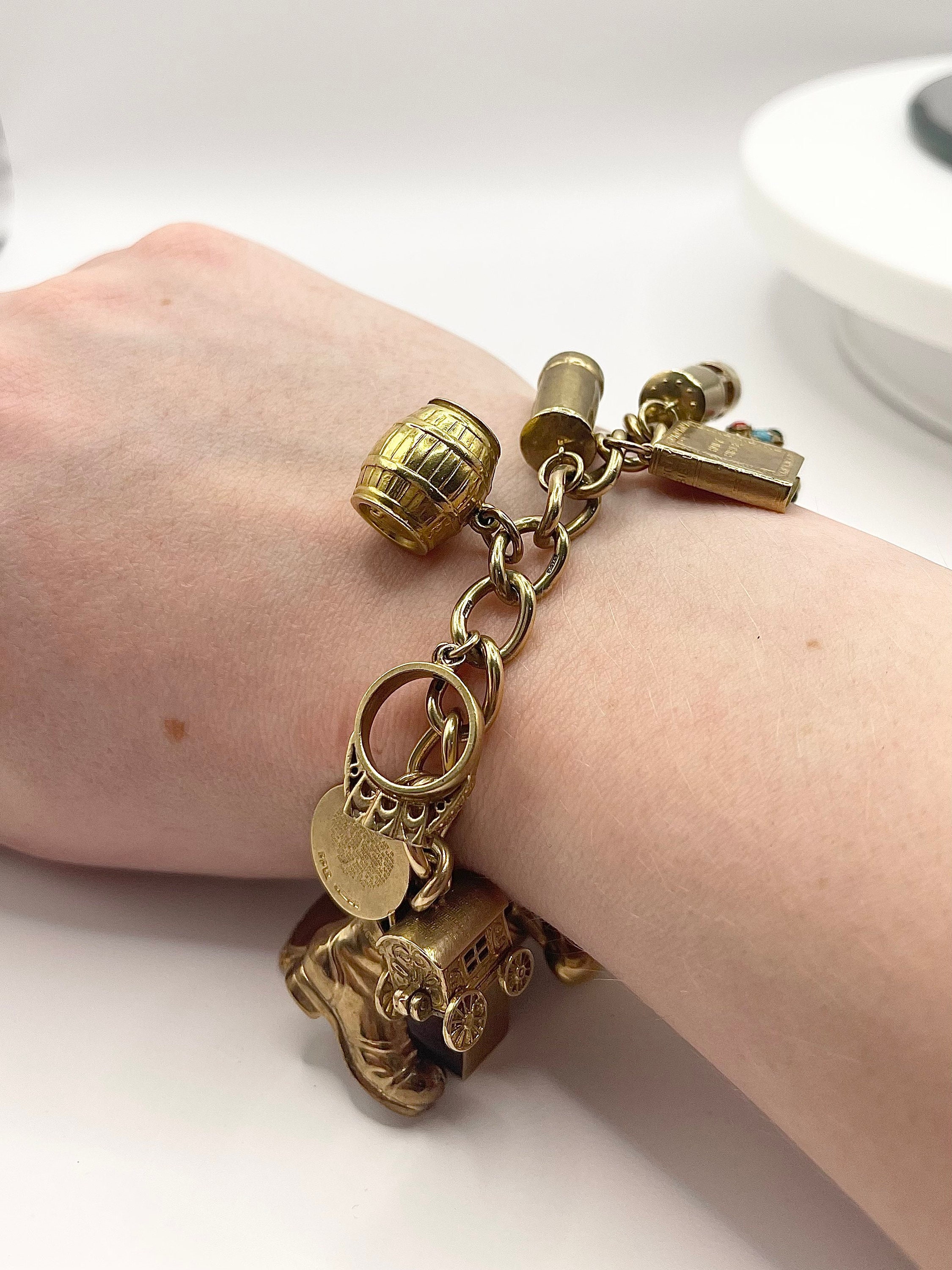 Traditional 1950s and 1960s Gold Charm Bracelet with Enamel and Mechanical  Charms