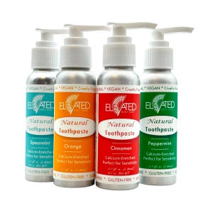 May include: Four silver pump bottles of Elevated Body Care natural toothpaste in spearmint, orange, cinnamon, and peppermint flavors. Each bottle contains 2.7 fl. oz. (80ml) of calcium-enriched toothpaste, labeled as vegan, cruelty-free, and gluten-free.