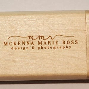 May include: A wooden box with the text "mmr McKenna Marie Ross design & photography" engraved on the front.