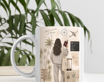 May include: White ceramic mug featuring a travel-themed design. The illustration depicts a person with long hair, holding a passport and boarding pass, with a suitcase and the text "collect moments not things". Palm trees and a departure board are also shown.