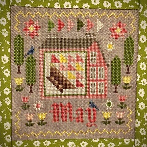 May include: A set of three ceramic mugs with a speckled, matte finish. Each mug features a different color: light blue, cream, and gray. The mugs have a simple, modern design and a comfortable handle. Perfect for coffee or tea.