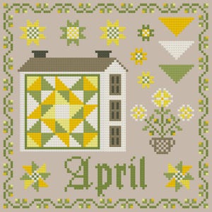 May include: Cross-stitch design featuring a house with a star quilt pattern, flowers, and the word "April." The color palette includes shades of yellow, green, and brown on a neutral background. The design is framed with a floral border.