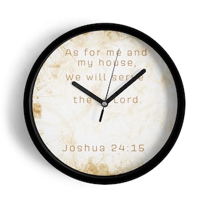 May include: Round wall clock with a black frame. The clock face has a cream-colored background with brown accents and the text "As for me and my house, We will serve the Lord. Joshua 24:15."