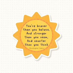 May include: A yellow sunburst with a quote from Christopher Robin: "You're braver than you believe, And stronger than you seem, And smarter than you think."