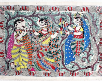 May include: A colorful Madhubani painting depicting three figures in a forest setting. The figures are dressed in vibrant colors and intricate patterns. The painting is done on a white background and features a detailed depiction of trees and foliage.