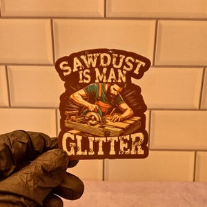 Sawdust is Man Glitter – Funny Woodworking Sticker, Mug, or T-Shirt – Carpenter Gift for DIYers, Woodworkers, & Craftsmen