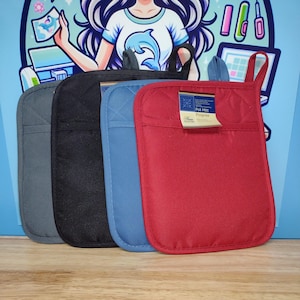 May include: Four pot holders in different colors: gray, black, blue, and red. The red pot holder has a label that says "Pogrebis Pot Mitt".