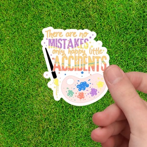 Puede incluir: Una pegatina blanca con un pincel y una paleta de pintura colorida. La pegatina dice "No hay errores, solo peque&ntilde;os accidentes felices."