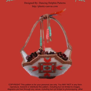 May include: A Southwestern-themed plastic canvas basket centerpiece with a geometric design in red, orange, turquoise, and brown. The basket is hanging from a beaded cord with turquoise and pink beads. The text "COPYRIGHT This pattern is for your personal use only. You MAY NOT in any form reproduce, transmit or distribute this pattern, including but not limited to images, diagrams and text through any venue, including but not limited to photocopying, other electrical or mechanical means, recording, or any other information storage and or retrieval system. Copyright © 2018 Dancing Dolphin Patterns" is at the bottom of the image.