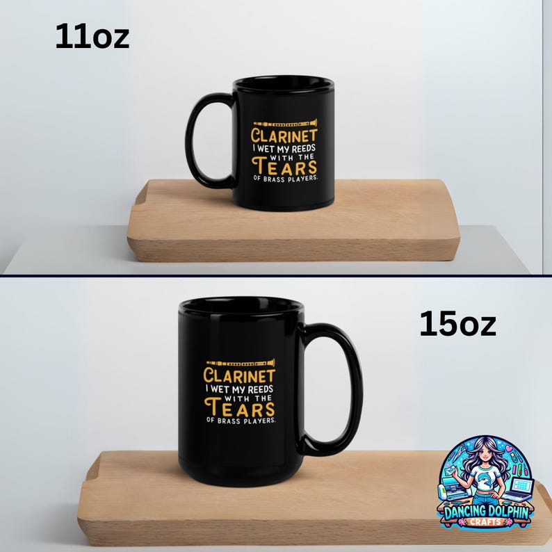 May include: Two black ceramic mugs with yellow text that reads Clarinet I wet my reeds with the tears of brass players. One mug is labeled 11oz and the other is labeled 15oz, each featuring a small graphic of a clarinet above the text.