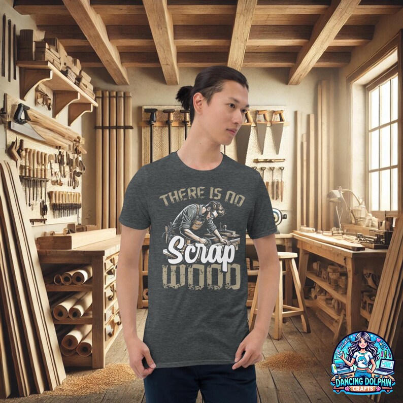 May include: A dark heather grey t-shirt with a woodworker illustration and the text "There is no Scrap Wood".