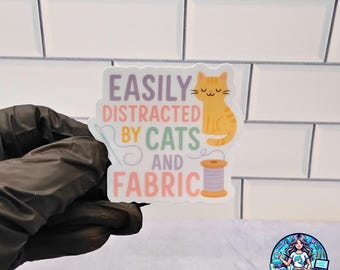 Easily Distracted by Cats and Fabric – Sticker, Mug, or T-Shirt – Funny Gift for Sewists, Quilters & Cat Lovers
