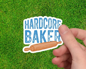 May include: A blue and white sticker with the text "HARDCORE BAKER" and a drawing of a rolling pin.